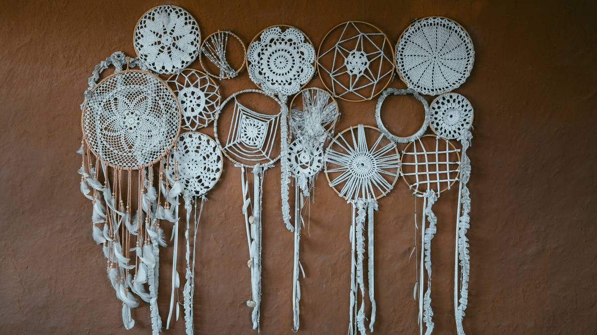 finished easy macrame wall hanging hanging vertically on white wall